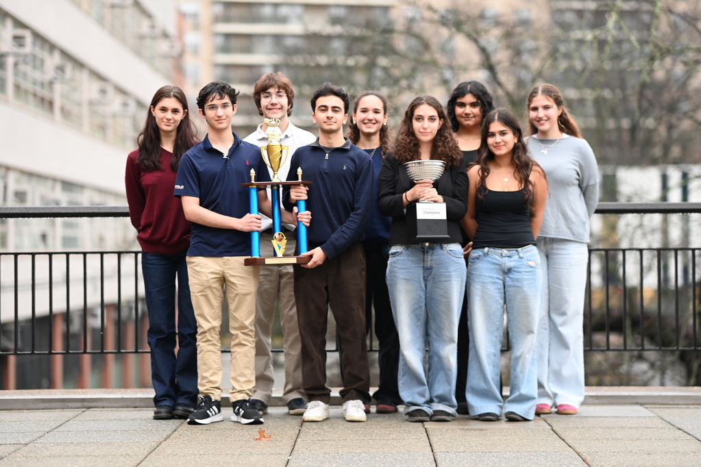 Here, the 2024-2025 Bronx Science Moot Court Team poses with their trophies after winning the championship. (Photo Credit: Alexander Thorp)